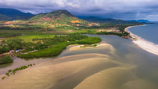 Aerial shot of a beautiful lake by Atlantic ocean